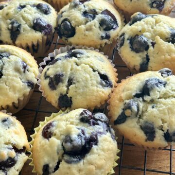 Baked lemon blueberry muffin on wire rack to cool