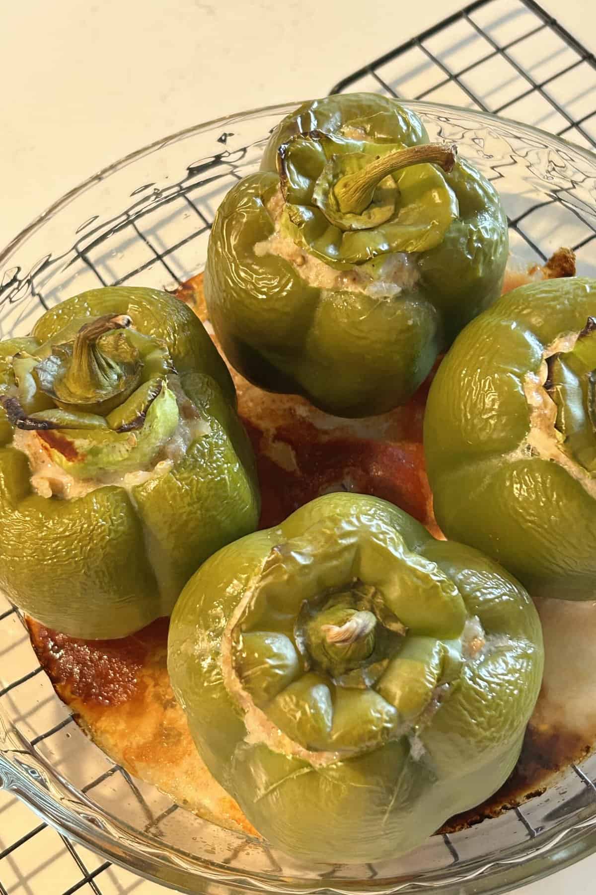 Stuffed peppers baked and cooling on a rack