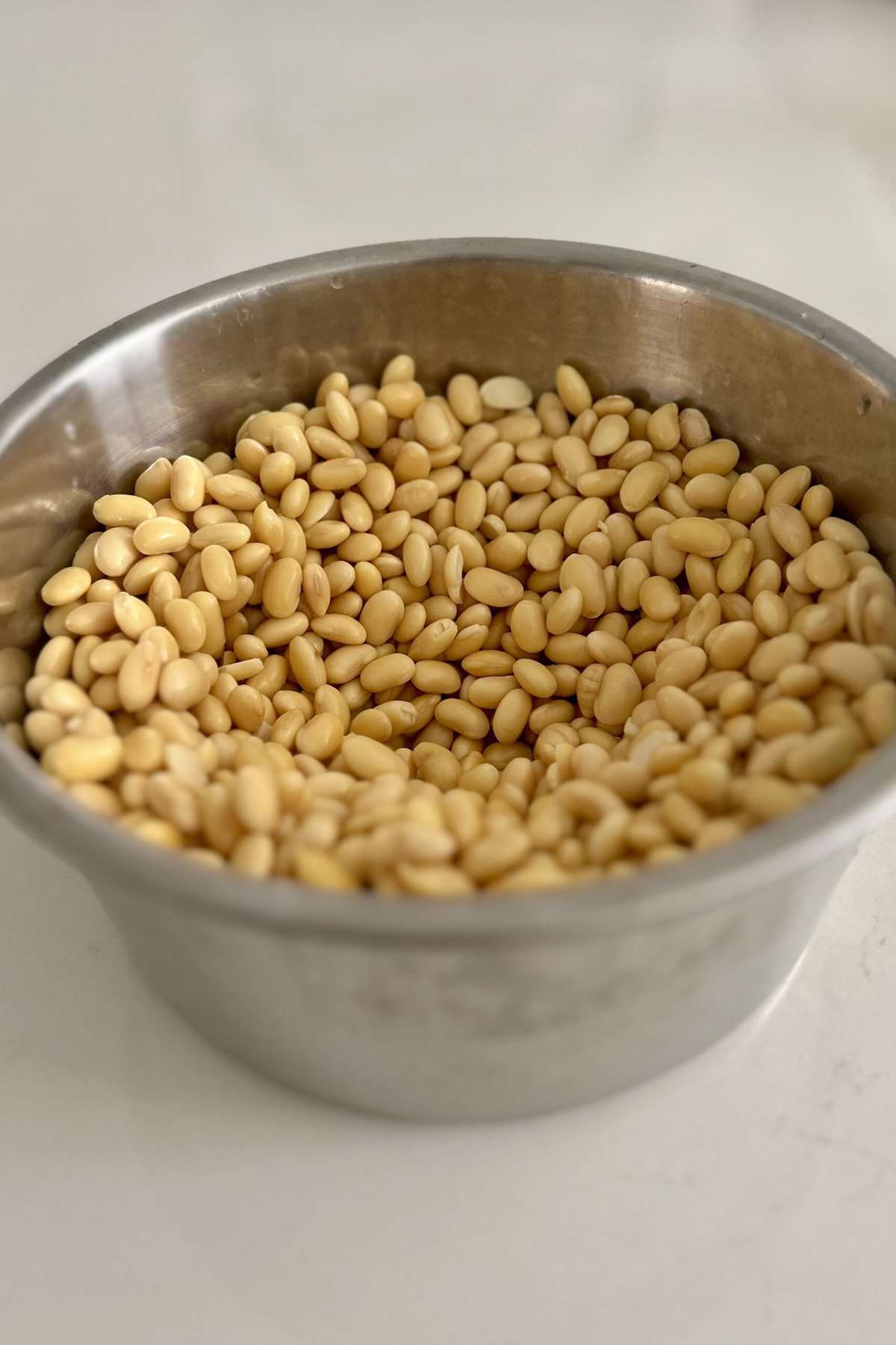 Soy beans soaked, washed, drained in the inner pot of the Tatung rice cooker