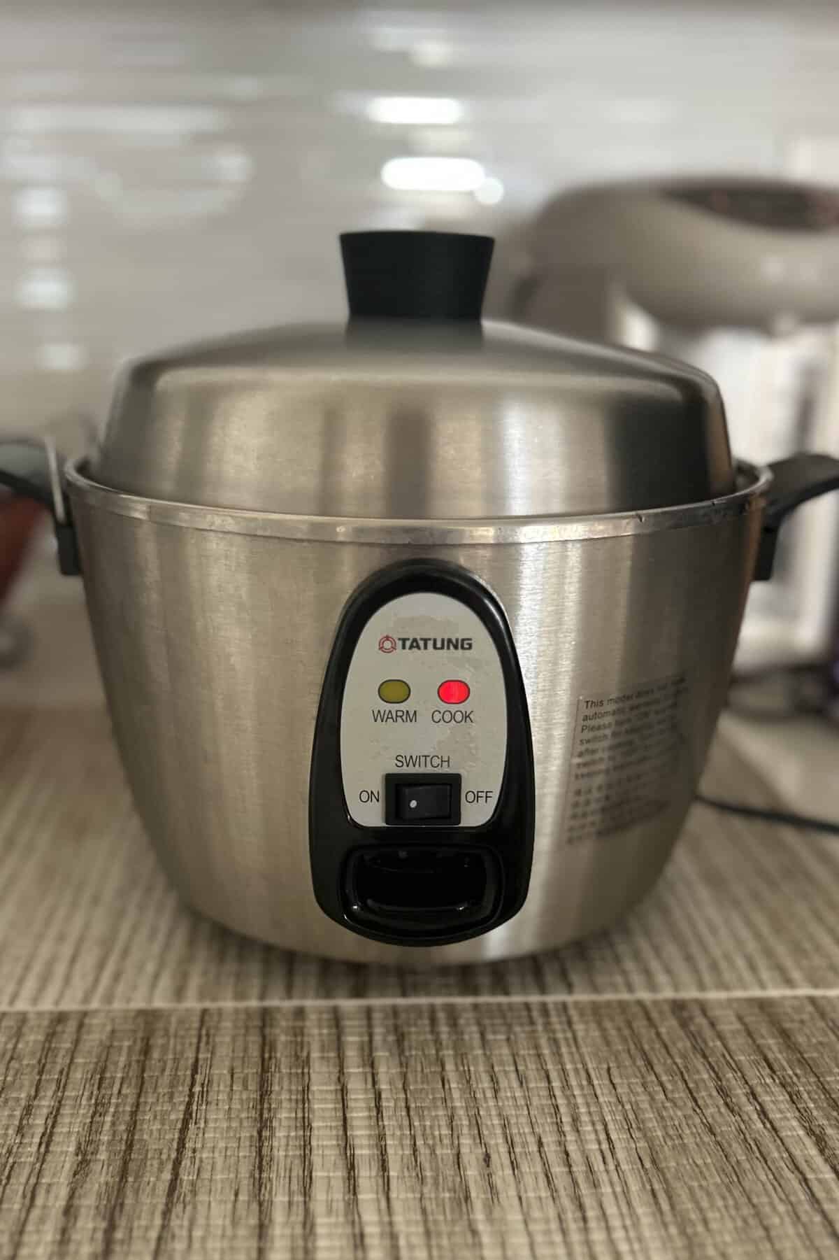 Soy beans are being cooked in the Tatung rice cooker