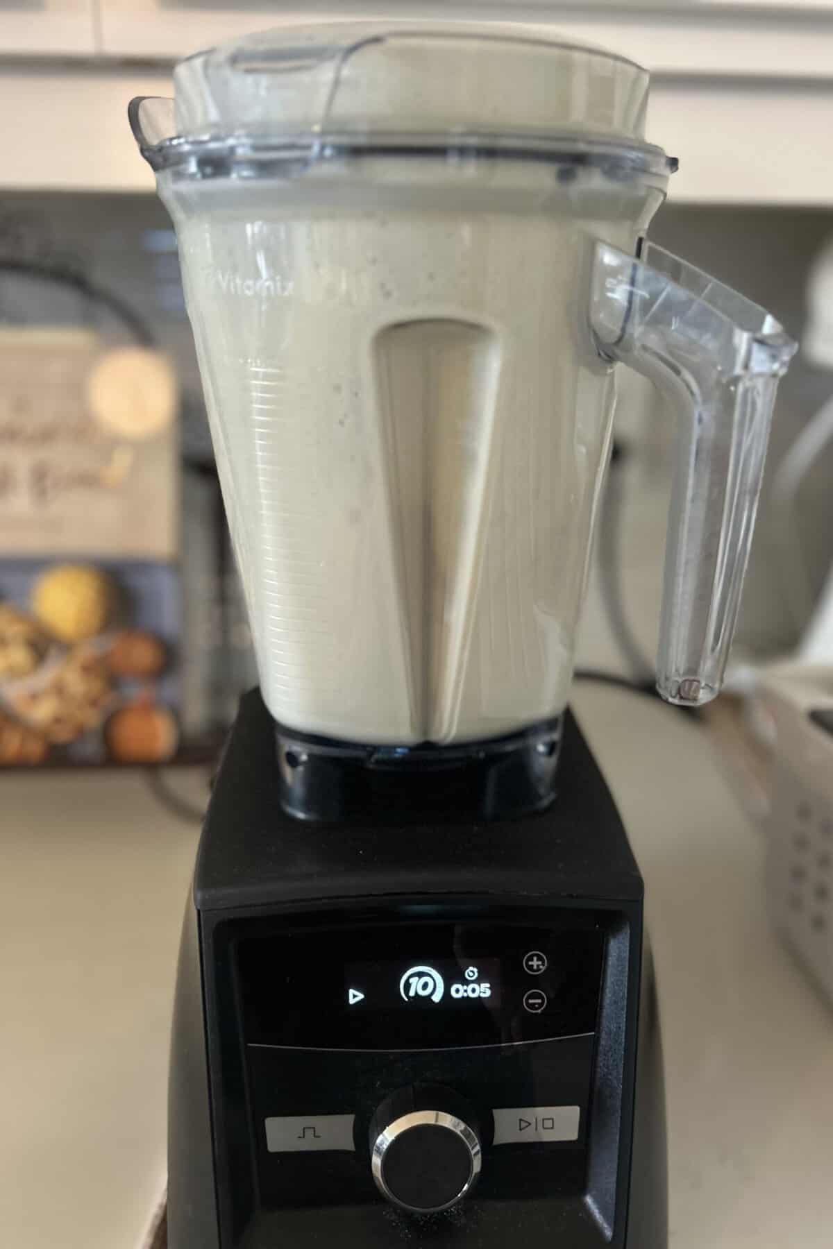 Blend the soy beans and water in Vitamix blender for one minute while increasing the speed from 1 to 10.