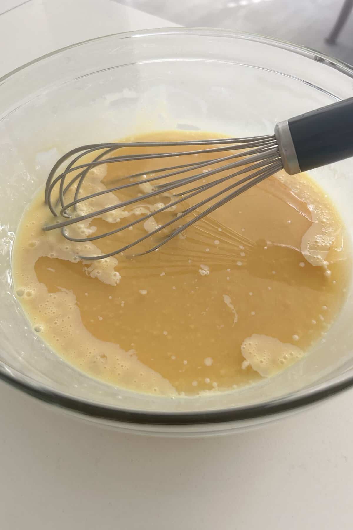 Add key lime juice concentrate and lime essential oil to the batter