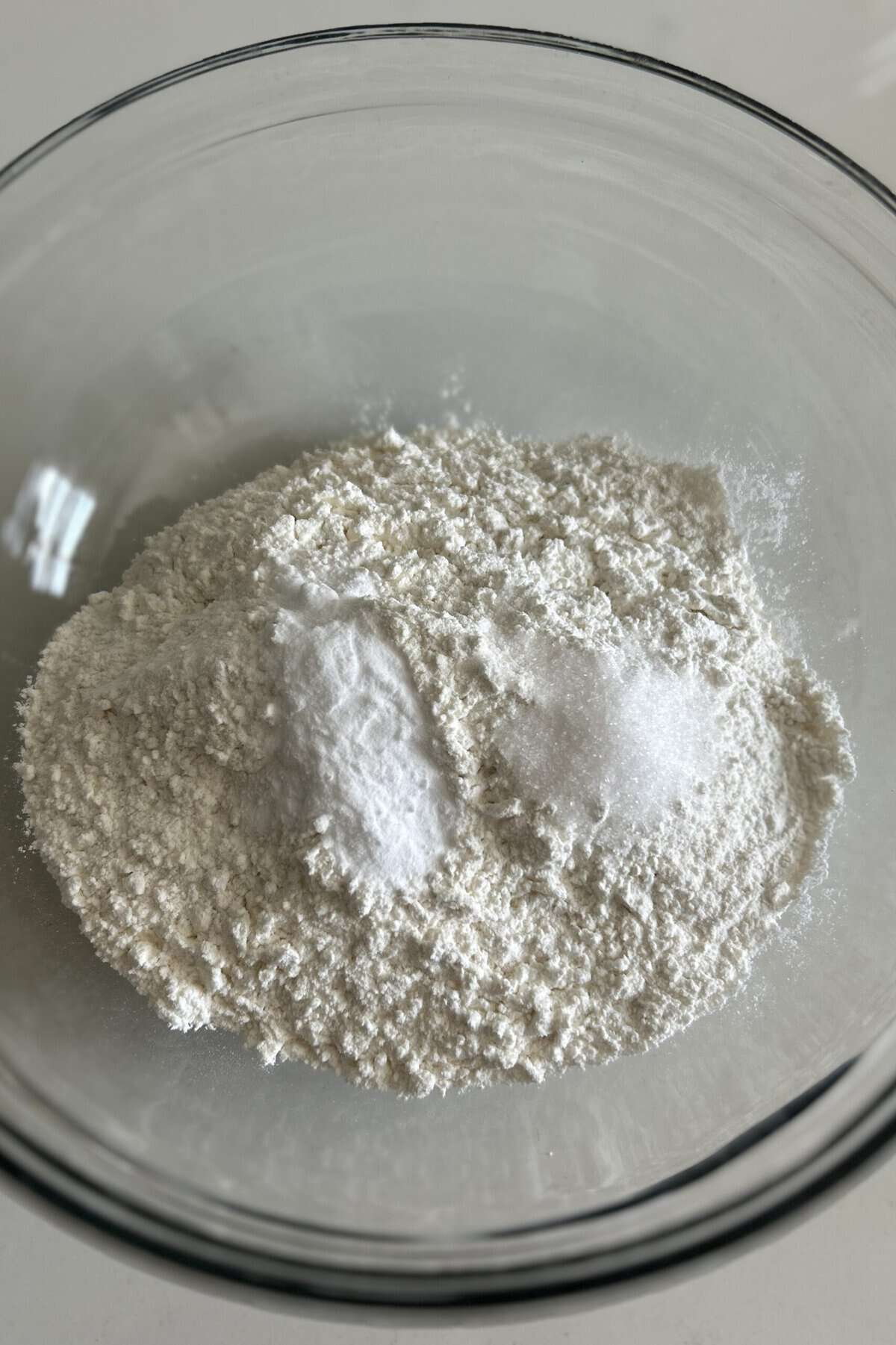 Flour, baking soda, salt in a glass mixing bowl