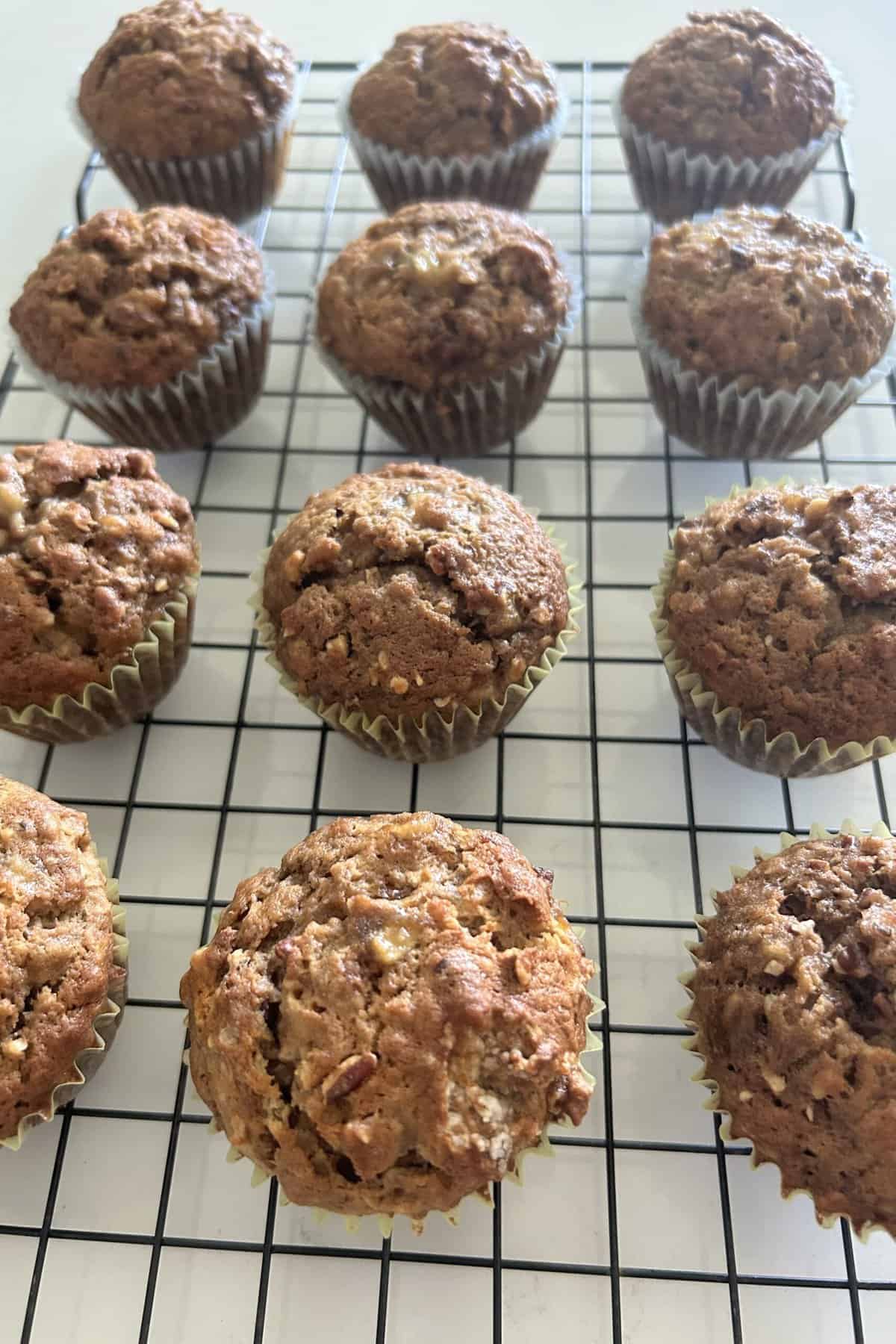 Baked banana nut muffins on a wire rack