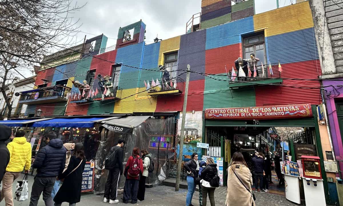 Tango dancers on balconies in one of the buildings in the Caminito neighborhood