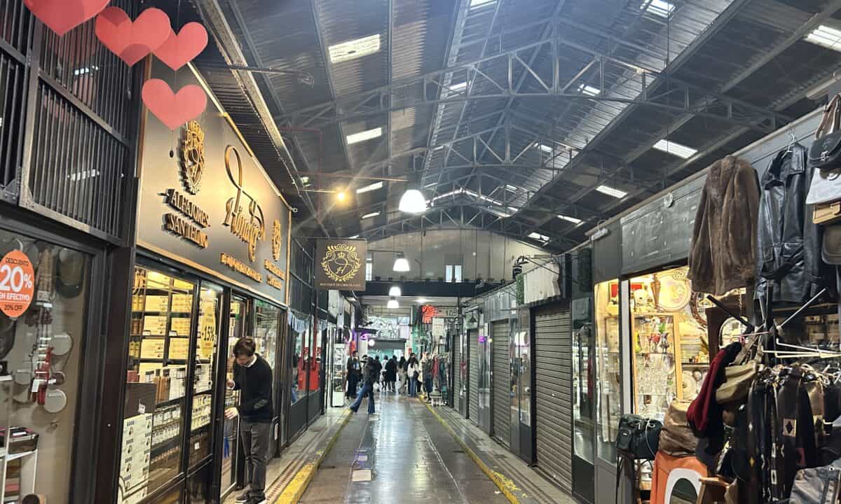 A long corridor of small stores in the San Telmo Market