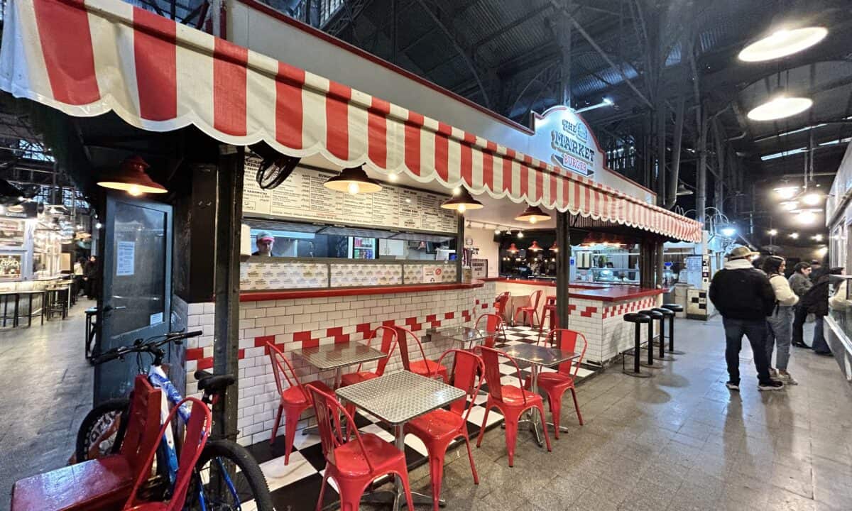 A burger market decorated with white and red in San Telmo Market