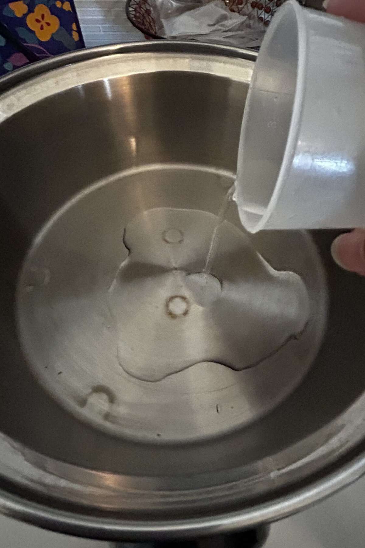 Pour measured water into the outer pot of the Tatung rice cooker