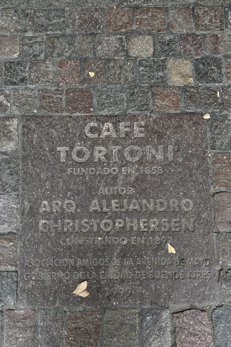 Cafe Tortoni plaque on the street in front of the cafe in Buenos Aires