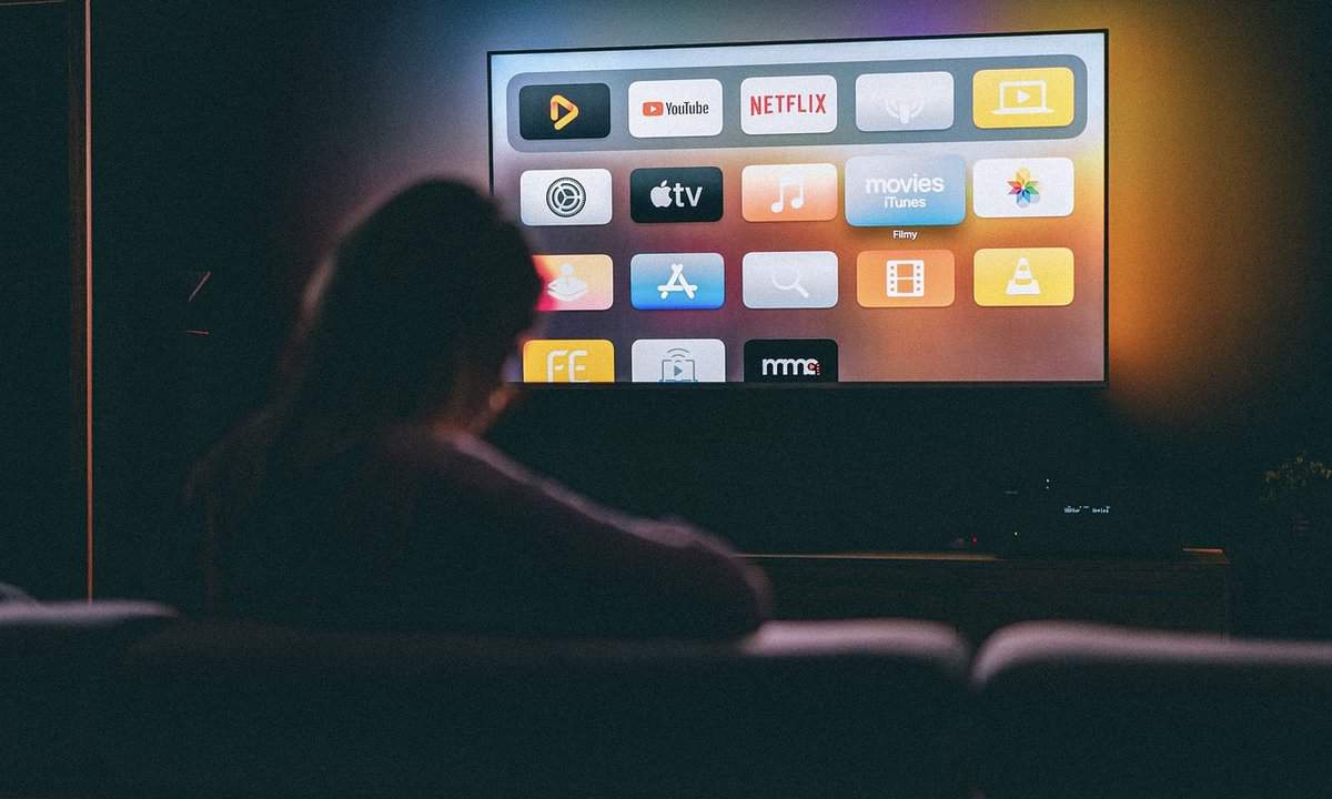 A person watching TV