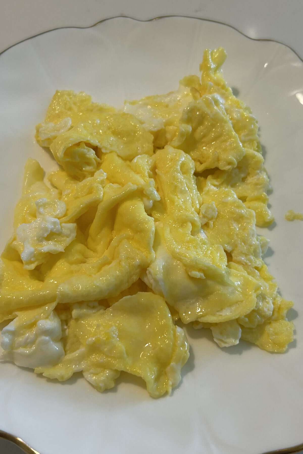 Scrambled eggs on a white plate